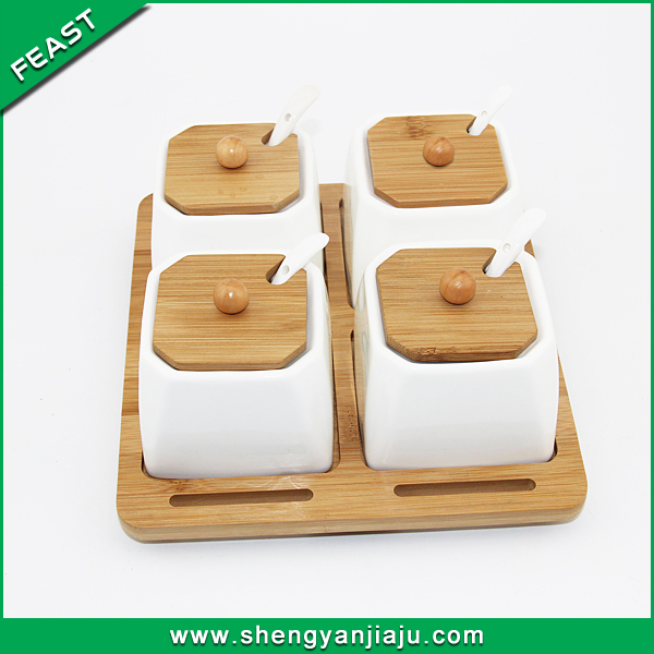White ceramic kitchen canisters with bamboo lid